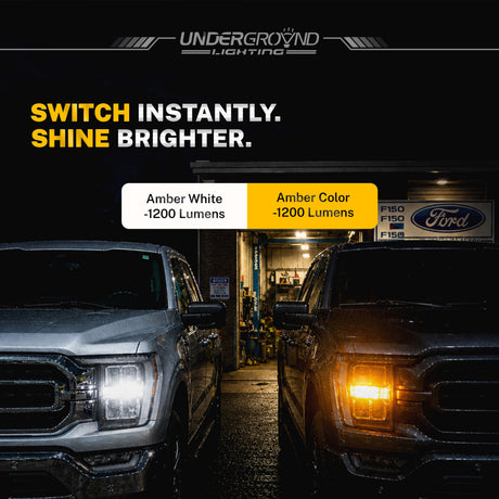 Two trucks with headlights on, one white and one amber, in a garage setting with 'UndergrounD Lighting' branding.
