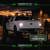 White Ford F150 truck with illuminated white rear lights at sunset, featuring Underground Lighting branding.